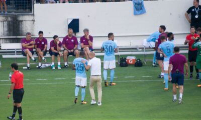 Pep Guardiola speaking with a Manchester City player near the touchline, used as the feature image for Manchester City final-weekend reset analysis.